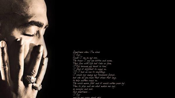 Free 2pac tupac holding face with hand in black background with words hd music wallpaper download