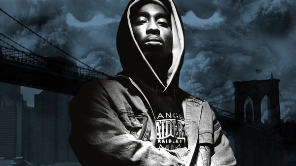 Free 2pac tupac is wearing head cap tshirt in sky background hd music wallpaper download