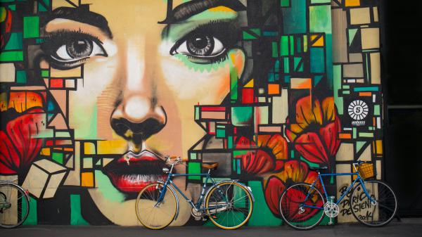 Free 3d two blue cruiser bicycles on graffiti wall 4k 5k hd wallpaper download