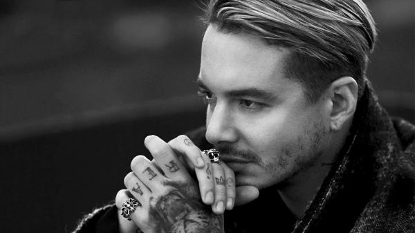 Free black and white photo of j balvin is facing one side wearing rings and having tattoos on hands hd music wallpaper download