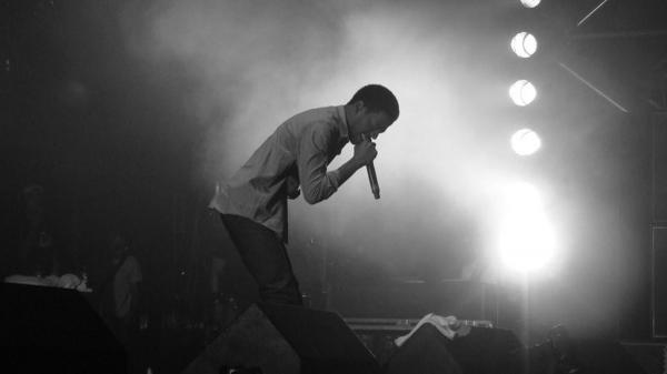 Free black and white photo of kid cudi holding mike in hand hd kid cudi wallpaper download