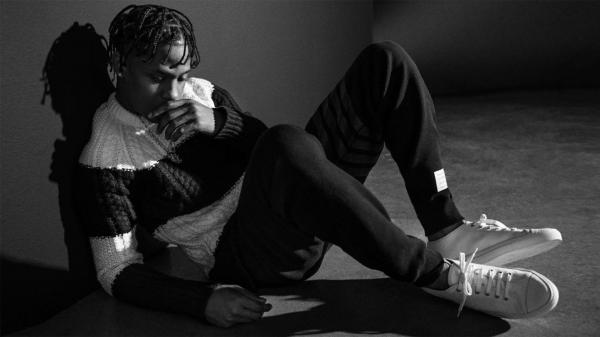 Free black and white photo of travis scott is looking down wearing black and white dress hd travis scott wallpaper download