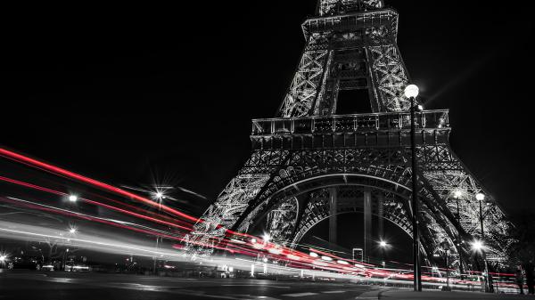 Free black and white picture of paris eiffel tower and red lights on road with dark sky background during night hd travel wallpaper download