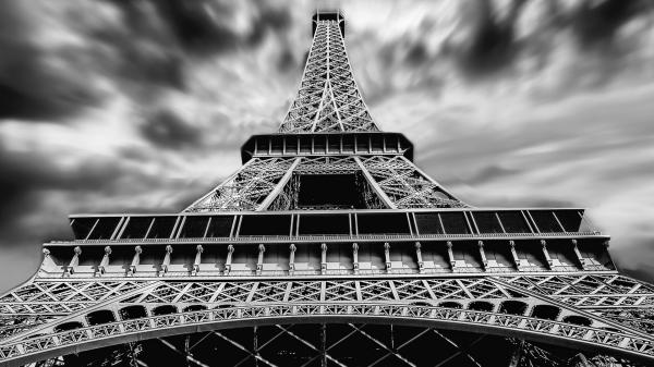 Free black and white upward view of paris eiffel tower with shallow background of clouds hd travel wallpaper download