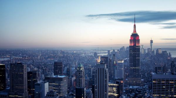 Free black cloudy sky above lighting buildings hd new york wallpaper download