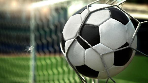 Free black white football in net in chain link fence background hd football wallpaper download