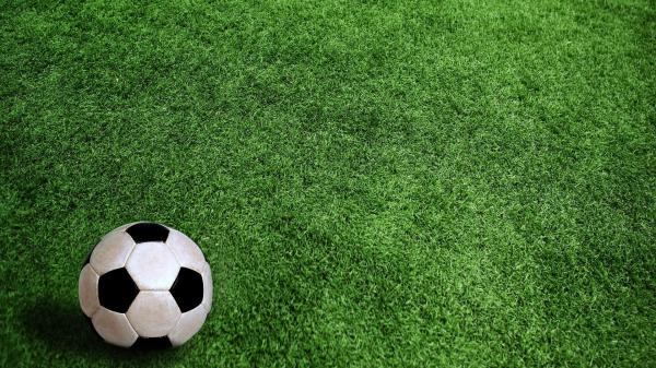 Free black white football on green grass hd football wallpaper download