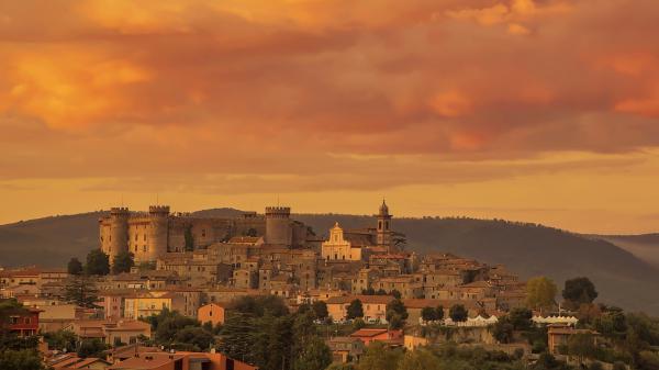 Free bracciano building house in italy under dusty cloudy sky hd travel wallpaper download