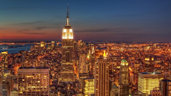 Free buildings with glittering golden lights in background of blue sky hd new york wallpaper download