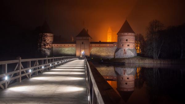 Free castle lithuania during nighttime with reflection on river trakai island castle 4k hd travel wallpaper download