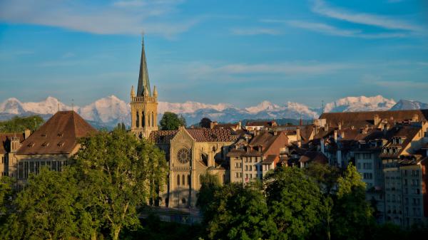 Free castle under blue sky with landscape of white covered mountain bern switzerland 4k 5k hd travel wallpaper download