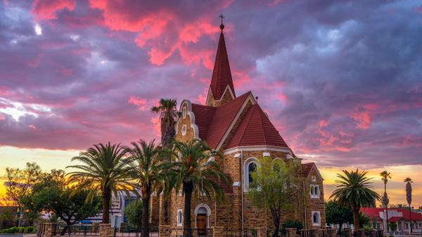 Free church under cloudy sky with palm tree during sunset in namibia hd travel wallpaper download