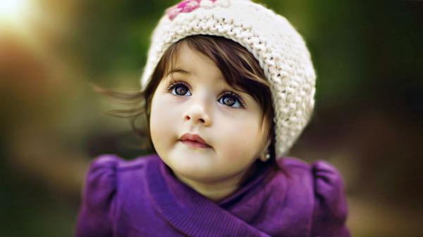 Free cute adorable girl baby is looking up wearing purple dress hd cute wallpaper download