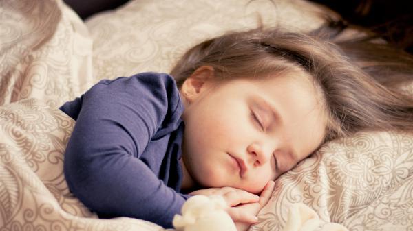 Free cute baby girl is sleeping on bed wearing blue dress 4k hd cute wallpaper download