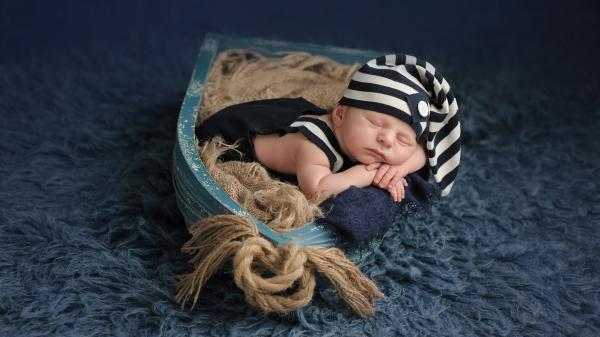 Free cute baby sleep in small boat 4k hd cute wallpaper download