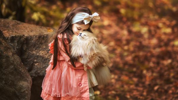 Free cute girl is wearing coral color dress having head band kissing puppy in a blur background hd cute wallpaper download