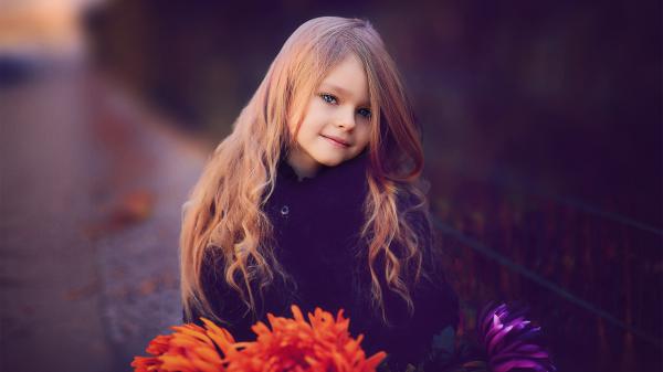 Free cute little girl is wearing black dress and having flowers in hands hd cute wallpaper download