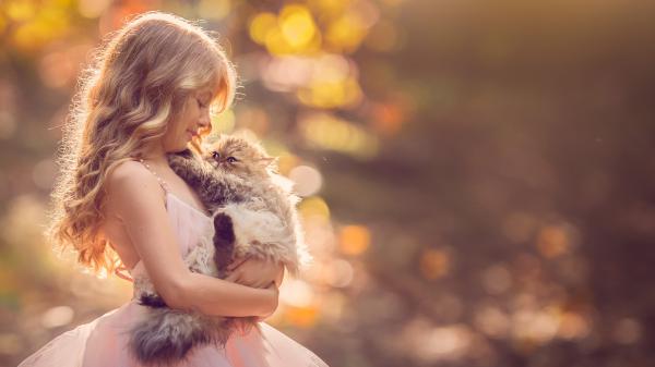 Free cute little girl is wearing light peach color frock having cat hands in a blur background 4k hd cute wallpaper download