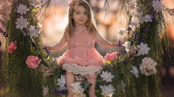 Free cute little girl on flower swing wearing peach color dress and headband hd cute wallpaper download