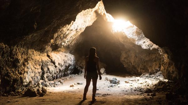 Free dark woman standing inside cave 4k hd wallpaper download