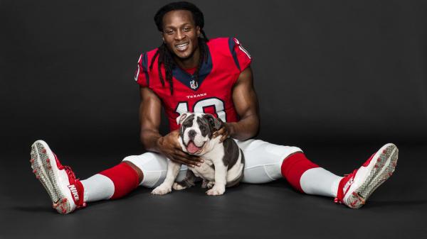 Free deandre hopkins is playing with puppy wearing red white sports dress hd deandre hopkins wallpaper download