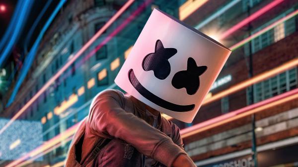 Free dj marshmello with led mask is wearing brown jacket in blur building background 4k 5k hd marshmello wallpaper download