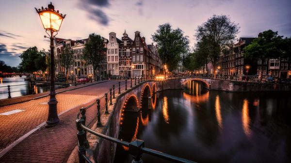 Free dock bridge near buildings in amsterdam canal netherlands hd travel wallpaper download