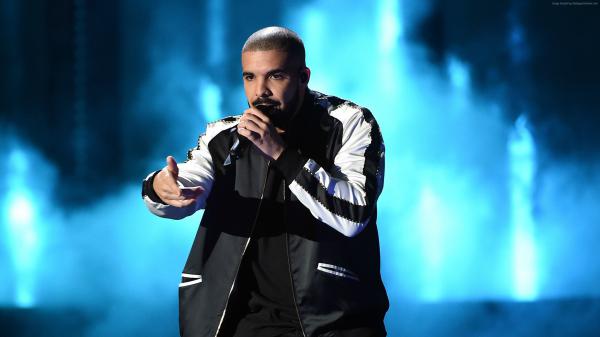 Free drake in blue background having mike in hand wearing black dress and jerkin hd drake wallpaper download