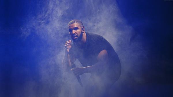 Free drake in sitting down in blue fog background hd drake wallpaper download