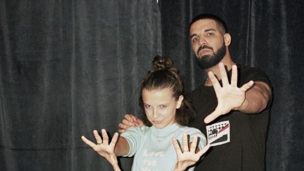 Free drake with little girl showing hands wearing black dress in black background hd drake wallpaper download