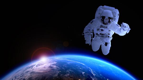 Free earth astronaut in space wallpaper download