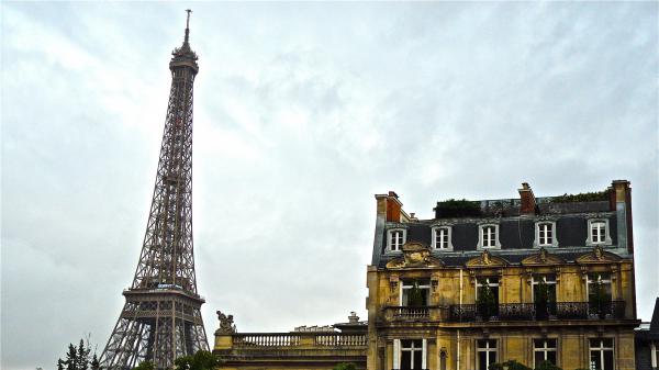 Free eiffel tower and old yellow building with background of clouds 4k hd travel wallpaper download