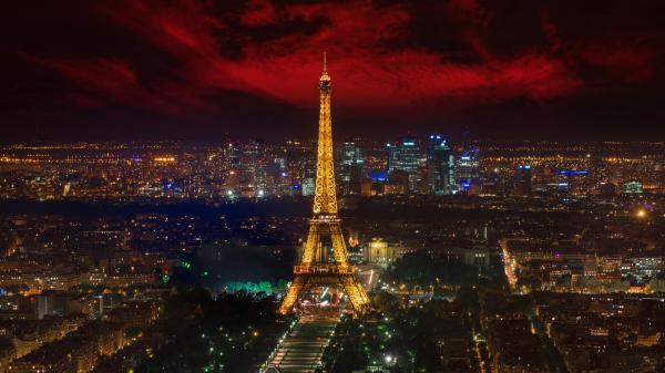 Free eiffel tower with yellow lighting and paris city with red and black sky background hd travel wallpaper download