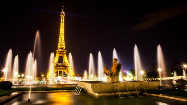 Free eiffel tower with yellow lights around water fountain with black sky background paris hd travel wallpaper download