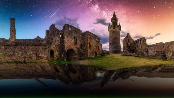 Free fortress castle with reflection on water under starry sky during nighttime 4k hd travel wallpaper download