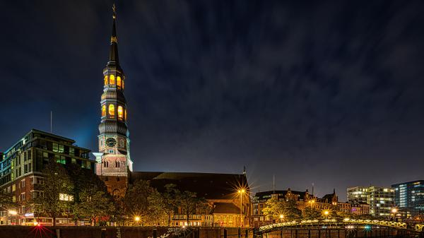 Free germany hamburg light house and bridge between river during nighttime hd travel wallpaper download