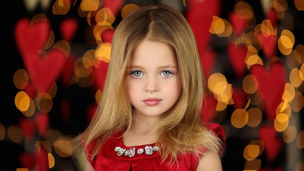 Free green eyes little girl with blonde hair is wearing red dress in red yellow lights background hd cute wallpaper download