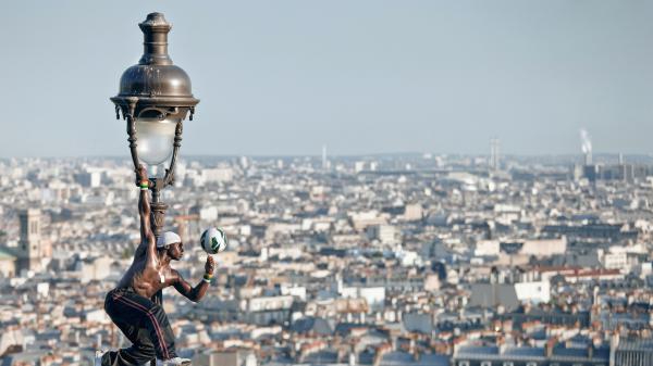 Free iya traore lantern playing soccer ball hanging on top of light france panorama paris hd travel wallpaper download