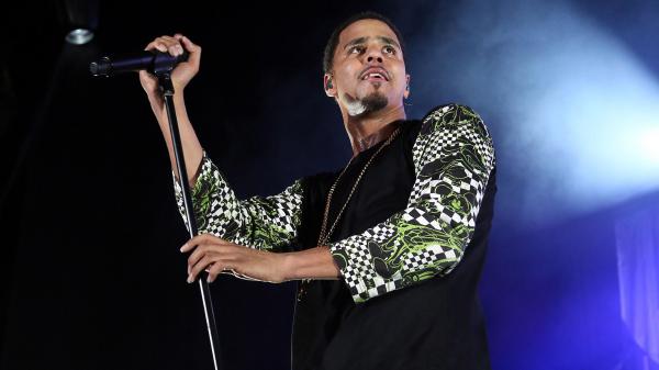 Free j cole is holding mike and looking up wearing black dress hd music wallpaper download