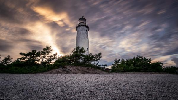 Free lighthouse under black cloudy sky hd travel wallpaper download