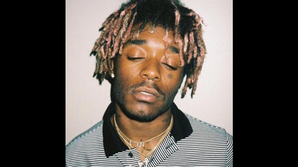 Free lil uzi vert is closing eyes and wearing black and white striped tshirt hd music wallpaper download