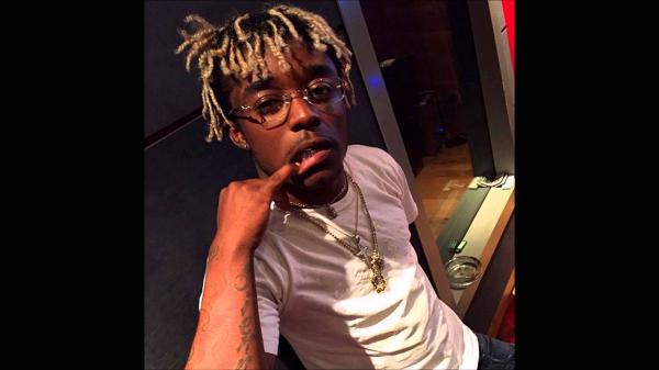 Free lil uzi vert is having finger inside mouth wearing white tshirt and chains hd music wallpaper download