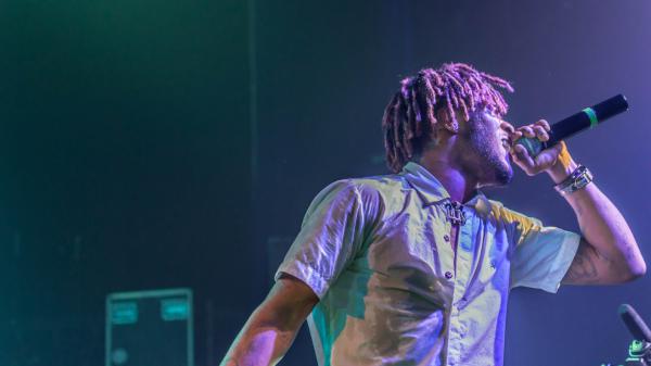 Free lil uzi vert is holding mike singing wearing white shirt facing one side hd music wallpaper download