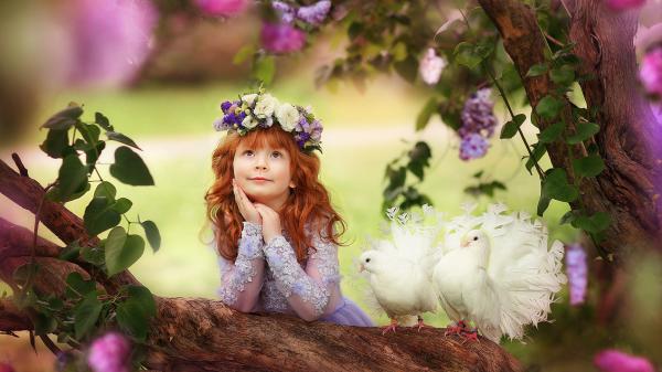 Free little cute girl is holding face with hand looking up leaning on tree trunk with pigeon nearby wearing redhead wreath hd cute wallpaper download