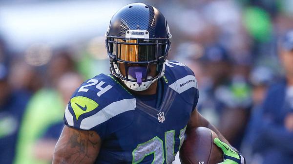 Free marshawn lynch with closed blue helmet wearing blue sports hd seattle seahawks wallpaper download