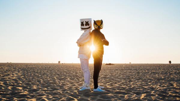 Free marshmello with vanossgaming standing on beach sand wearing white dress during daytime 4k 5k hd marshmello wallpaper download