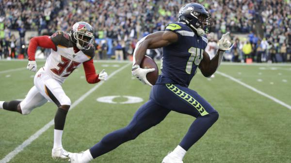 Free metcalf is running holding ball in one hand wearing blue sports dress and helmet hd dk metcalf wallpaper download