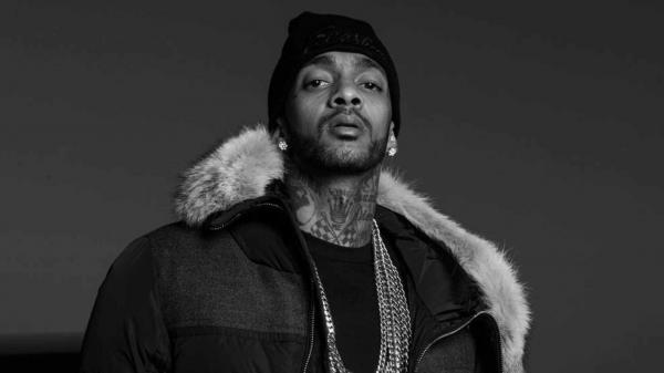 Free nipsey hussle in black background wearing black coat and chains on neck hd music wallpaper download