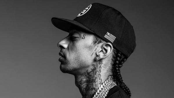 Free nipsey hussle is facing one side wearing chains and having tattoos on neck hd music wallpaper download