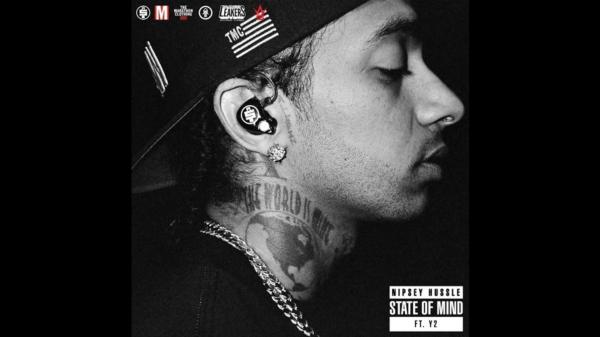 Free nipsey hussle is wearing black tshirt and cap having tattoos on neck facing one side hd music wallpaper download